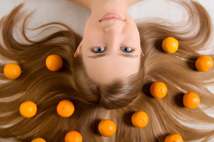 bigstock-young-girl-tangerine-orange-12225275