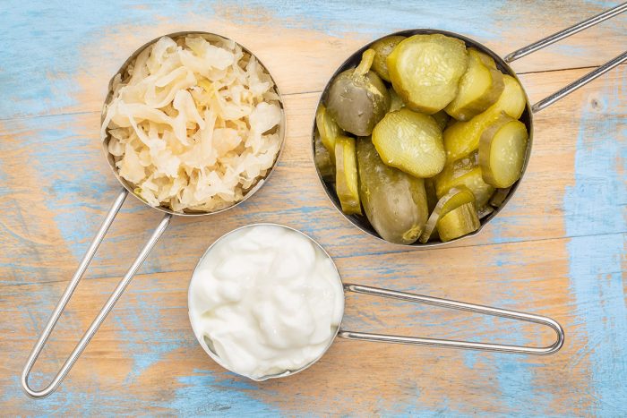 sauerkraut, cucumber pickles and yogurt - popular probiotic ferm