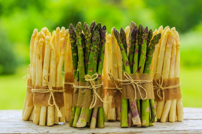 Asparagus - bunches of white and green asparagus